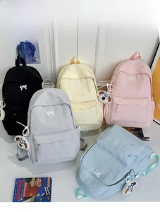 Minimalist nylon backpacks with bow embroidery and cute plush dog charm in five colors