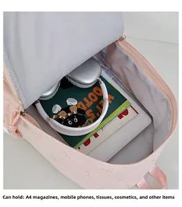 Detail of pink backpack interior capacity with space for tablets and magazines