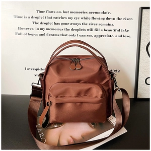 Versatile bronze nylon multi-purpose backpack with adjustable straps and silver hardware