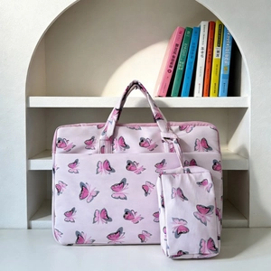 Detailed macro view of butterfly print tote bag with a matching small hanging pouch