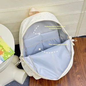 Detail view of starry school backpack with internal padded sleeve and organizer pockets