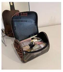 Close-up of leopard print makeup bag with transparent TPU lid for clear organization