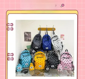 Polka dot backpack set with matching small pouches in various vibrant colors