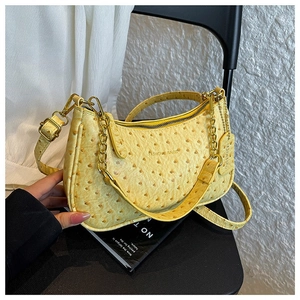Yellow ostrich texture shoulder bag with metal chain and fashion brand tag