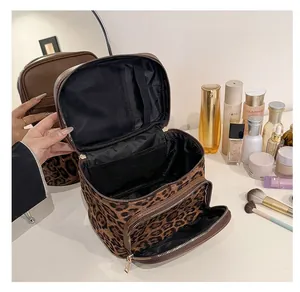 Detail view of the leopard print makeup bag interior compartments and zipper pockets