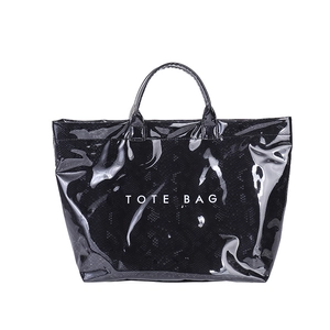 Glossy black tote bag with croc-embossed texture and minimalist white lettering