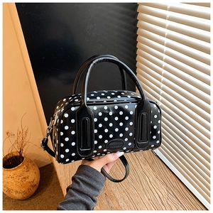 Polka dot Boston handbag with glossy finish, round handles and adjustable shoulder strap