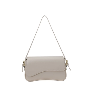 Retro cream beige underarm bag with wavy flap design and elegant gold hardware