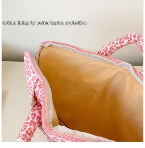 Detailed view of plush padded interior lining and leopard print for laptop protection
