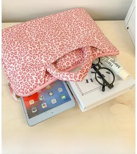 Detailed top view of pink leopard print laptop sleeve with sturdy handle and zipper