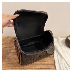 Close-up of double-layer leopard print makeup bag with WAIT PARIS embossing