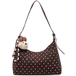Dark brown polka dot hobo bag with a cute plush dog pendant and adjustable shoulder strap