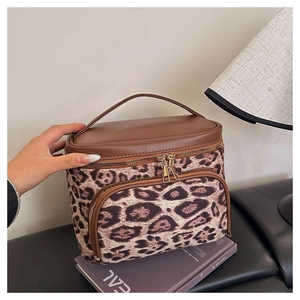 Luxury leopard print faux suede cosmetic bag with brown leather handle and zipper