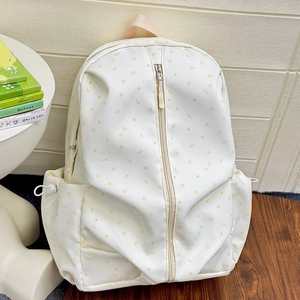 Cream canvas star pattern student backpack with center zipper and pink handle