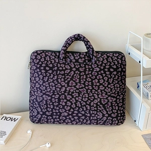 Stylish purple leopard print knit laptop tote bag with sturdy handles and zipper closure