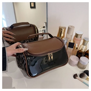 Double-layer brown leather and leopard print travel toiletry bag with gold zippers