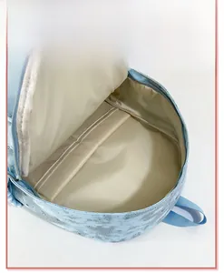 Internal view of a light blue star sequin backpack showing spacious main compartment