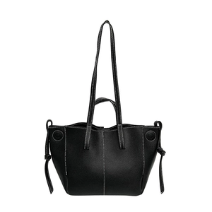 Minimalist black lychee leather tote bag with white contrast stitching and drawstring details