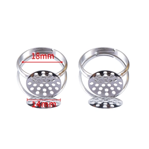 Macro view of adjustable silver metal ring base with 14mm round sieve tray for DIY jewelry