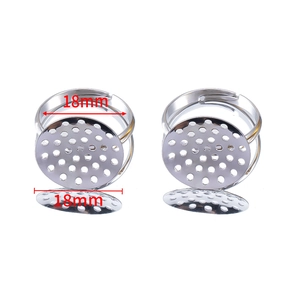 Detail view of 18mm adjustable silver metal ring bases with round filigree trays