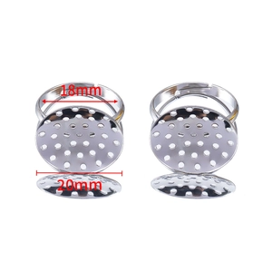Detail view of 18mm adjustable silver ring base with 20mm round perforated setting