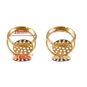 Close-up of 14mm round gold metal ring bases for DIY jewelry making accessories