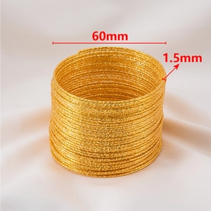 Detail of 60mm diameter multilayer golden textured bangles with 1.5mm width specs