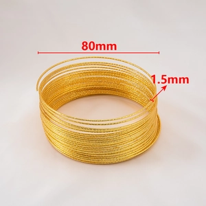 Detail view of 80mm gold textured steel wire coils with 1.5mm thickness for jewelry making
