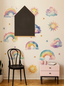 Close-up of watercolor rainbow and sun wall stickers in a cozy nursery room setting