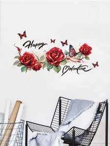 Artistic display of Valentine wall stickers with red roses and cursive lettering on a white wall