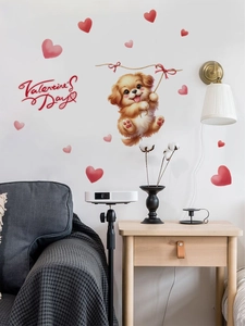 Detail of cute Valentine dog wall decal with hearts on white wall above a sofa
