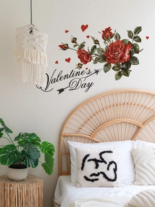 Detail showing red rose wall decals with Valentine's Day text in a cozy bedroom