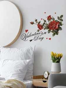 Detail of red roses and Valentine's Day wall decal in a warm bedroom setting