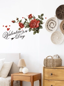 Detail of red rose wall stickers and Valentine's Day text on a bedroom wall