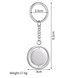Close-up of rotatable silver metal keychain with precise size measurements in centimeters