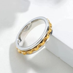 Modern 6mm two-tone stainless steel spinning fidget ring with silver and gold textured band