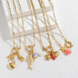 Elegant 18k gold long fish pendant necklaces with ocean charms and coral accents