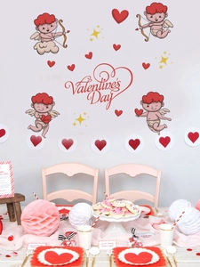 Wall decoration featuring Cupid stickers and Valentine's Day art lettering on white surface
