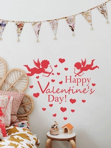 Detail of red Cupid and hearts wall stickers with Happy Valentine's Day text on white wall