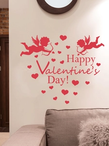 Detail of red Valentine's Day wall stickers with Cupid and hearts on a beige wall