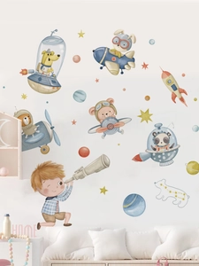 Detail of cartoon animal astronaut wall stickers with planets in a nursery room