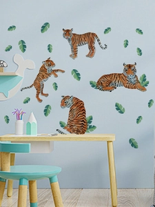 Detail of four illustrated tigers and green tropical leaves on a nursery wall sticker
