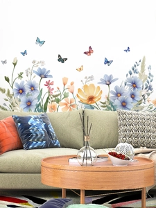 Detailed close-up of watercolor floral and butterfly PVC wall stickers on a living room wall