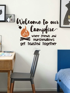 Cozy bonfire wall sticker with welcome text displayed in a modern bedroom setting