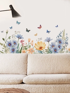 Detailed view of floral wall decals featuring watercolor flowers and butterflies on a wall