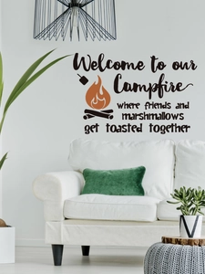 Detail of campfire wall sticker with toasted marshmallow text on a modern white living room wall