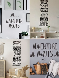 Detail of Adventure Awaits and Camping Rules wall decals in mountain forest design