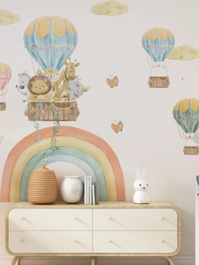 Detail of watercolor rainbow and forest animal hot air balloon wall stickers in nursery