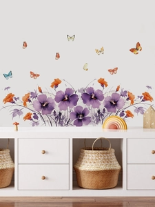 Detail of floral wall stickers with purple hibiscus flowers and colorful butterflies