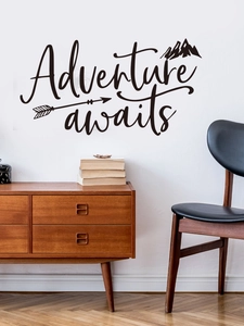 Detail of Adventure awaits wall sticker with mountains and arrows on a white wall